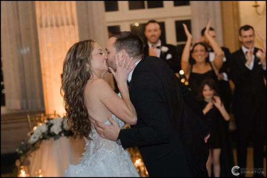 bride and groom kissing at Marriott Syracuse Downtown wedding reception: Syracuse, NY
